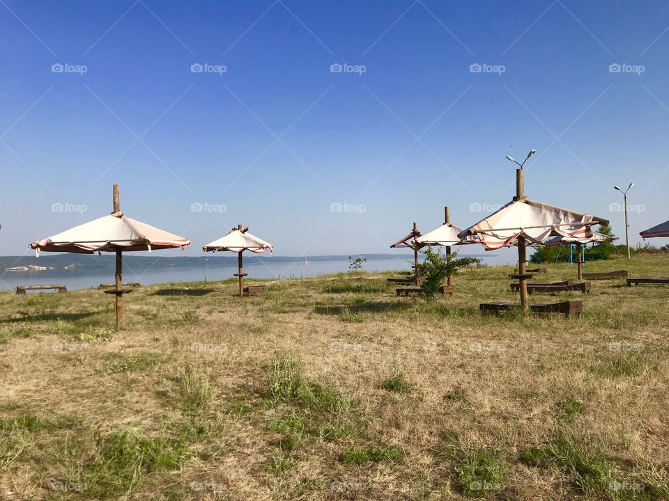 Umbrellas on the lake’s beach 
