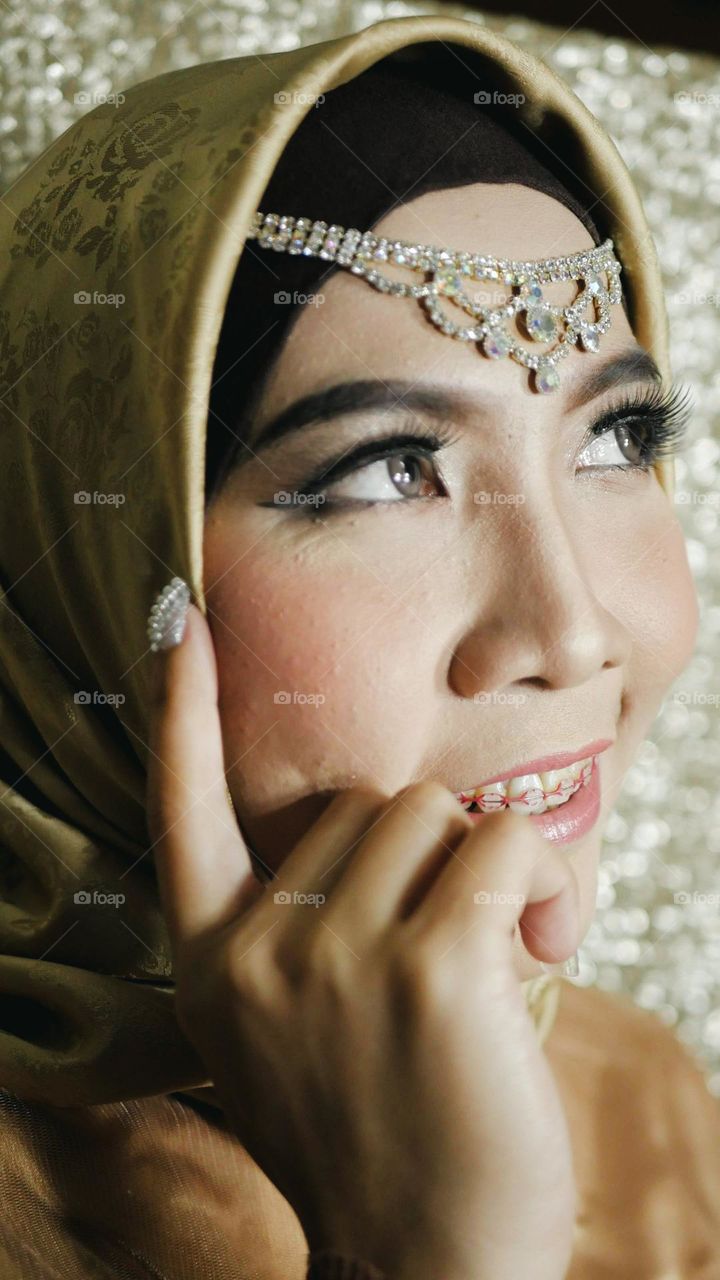 Portrait of a beautiful Asian woman with a happy smiling expression.