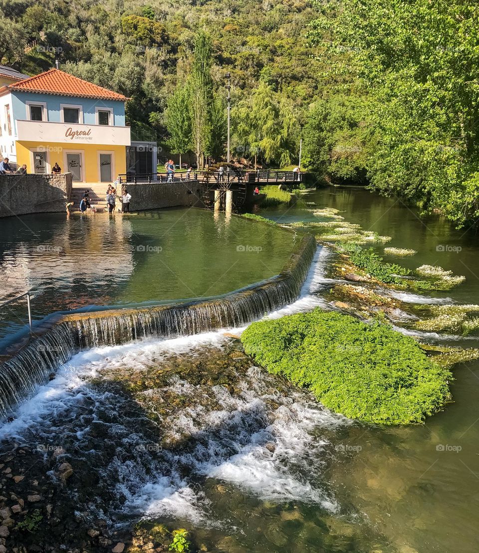 People enjoy themselves at Agroal river beach on a sunny day in central Portugal 