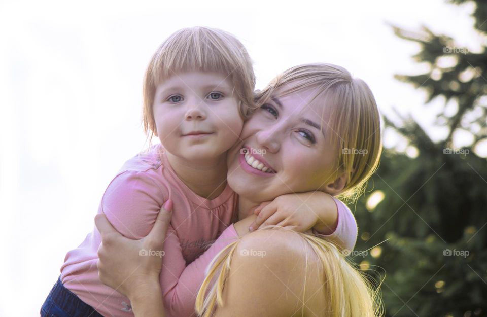 Mom hugging her daughter