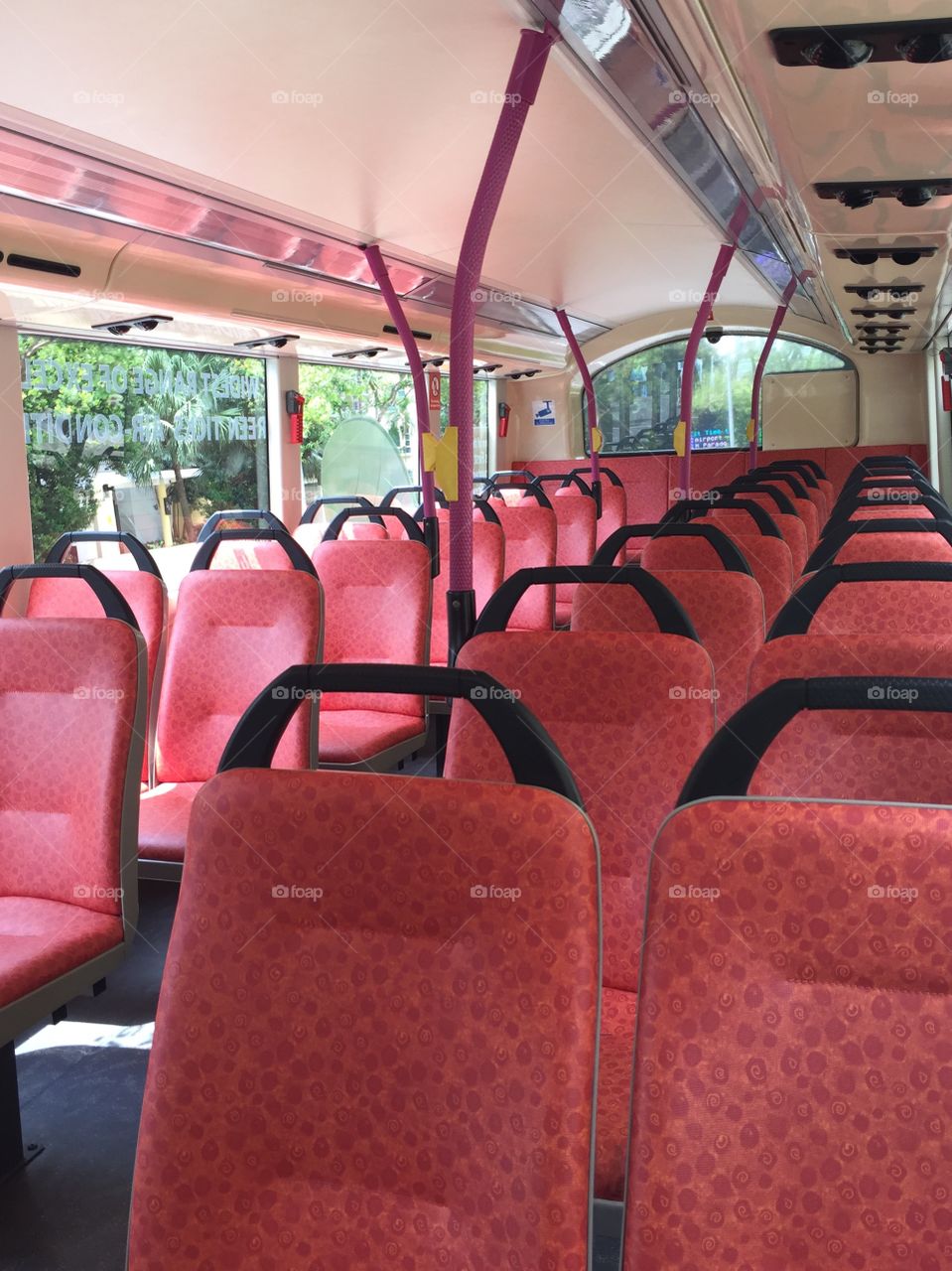 Empty upper deck seats in a double decker SBS bus