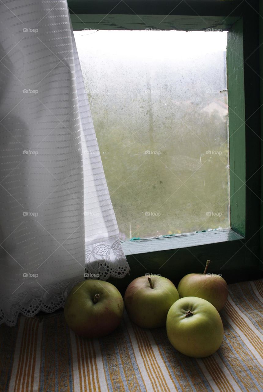 Apples on the inside window