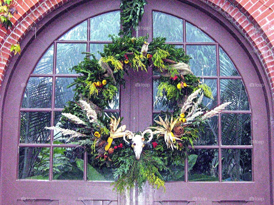 Fall Wreath. Unusual fall wreath adorns greenhouse doors!