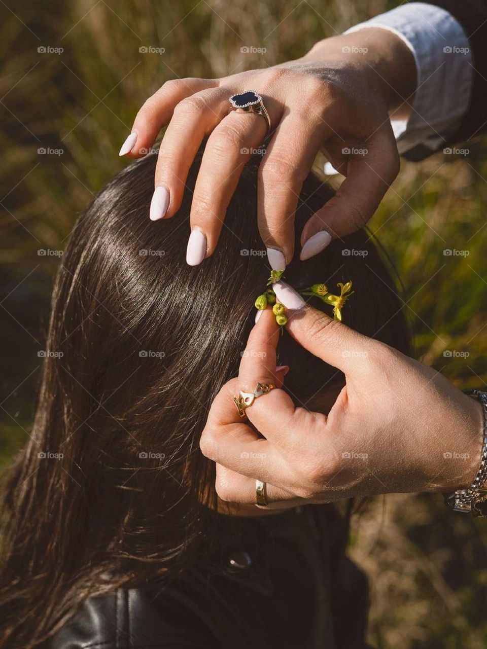 The beautiful girl is a doll in her mother's hands. I know the pleasure of caressing and fixing a child's hair is magical. These moments should be appreciated. moments of Love, and love and just love..