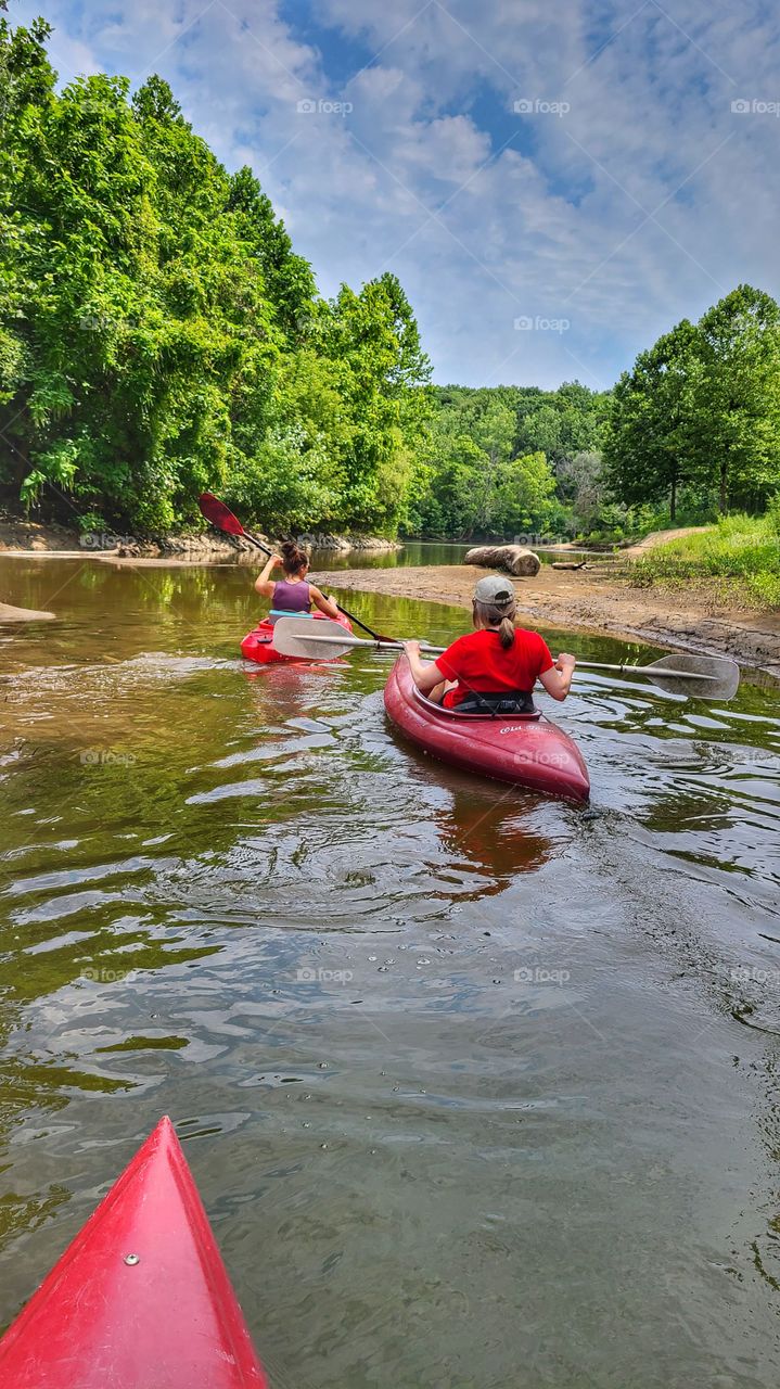 two women kayaking