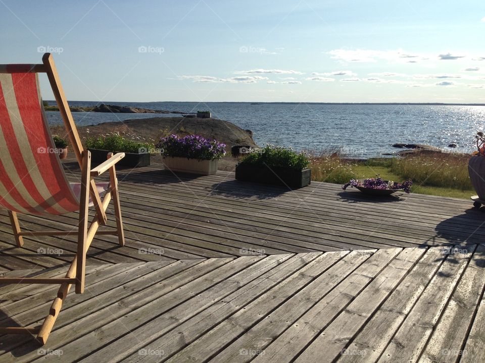 Summer by the sea. Summer, sunshine, the sea and a lounger. 