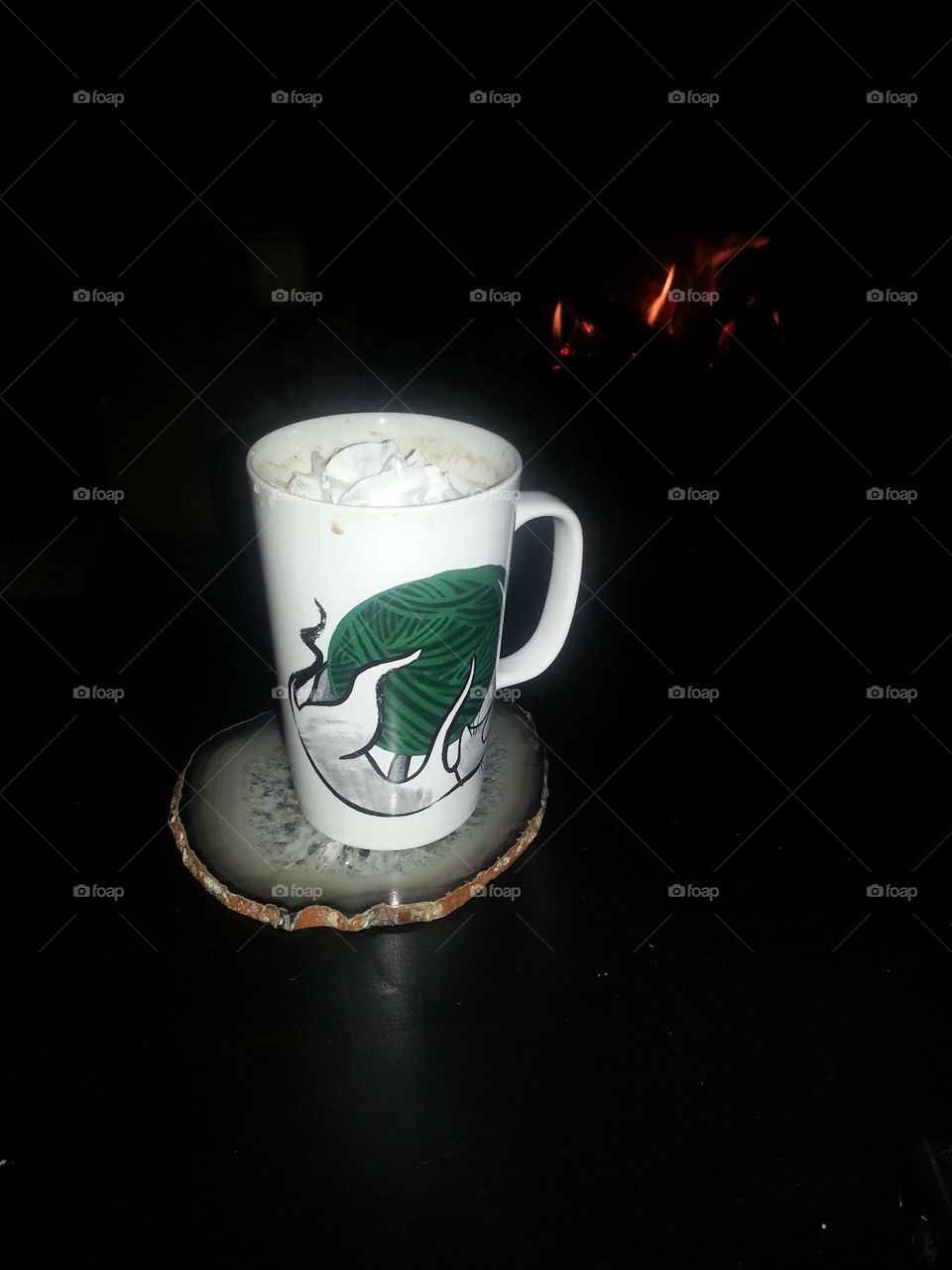 that was chocolate milk until I placed it by the fire. now it's whipped itself into a delicious hot chocolate. hang out long right and kitty might spin a yarn.