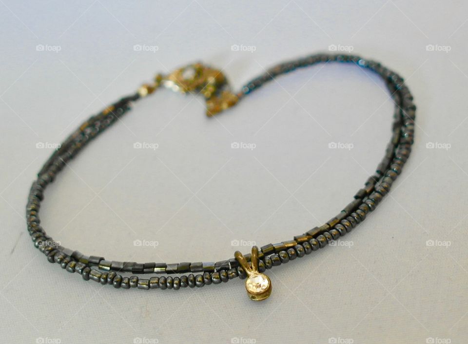 Anklet on grey background
