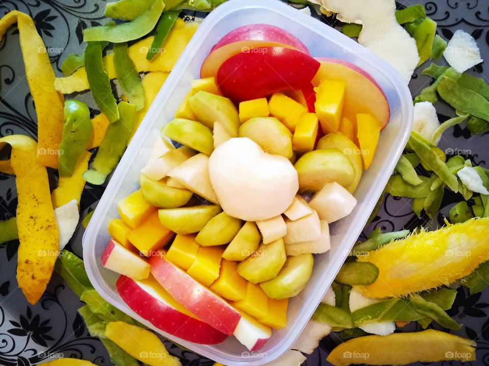 Fruits box with apples, mangoes, yam bean, ambarella.