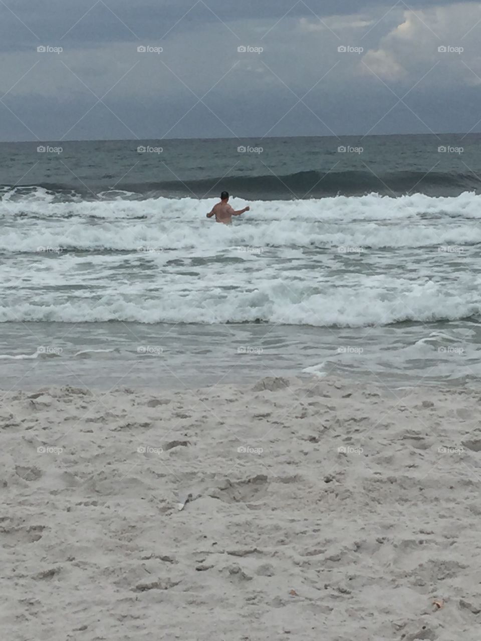 Watching my husband act like a big kid in the water in our first trip to the beach after moving to Florida