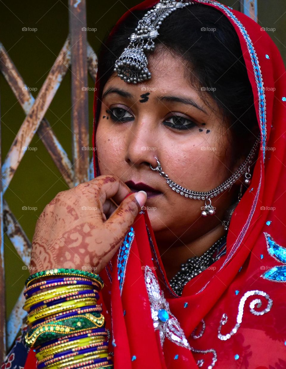 Rajasthani woman wearing traditional saree and jewelry