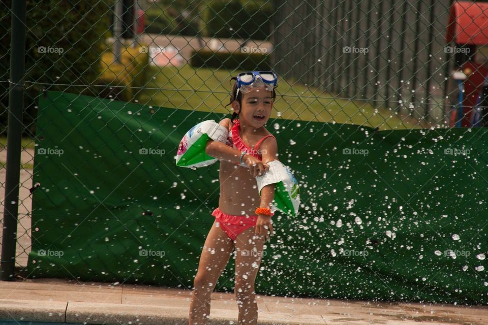 Little girl having fun with water