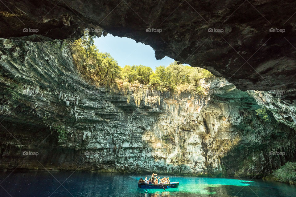 Tourists With Wooden Boat Visit Famous Cave Lake Melissani In Kefalonia Greek Island