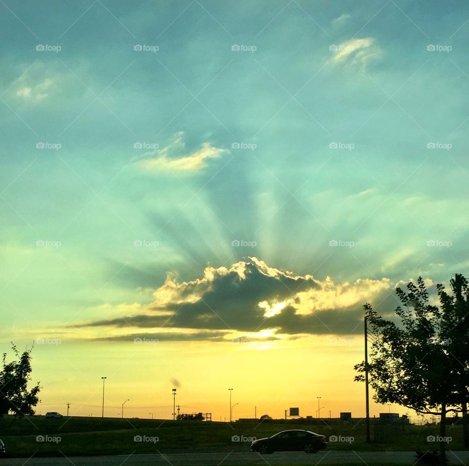 Sunrays behind a cloud