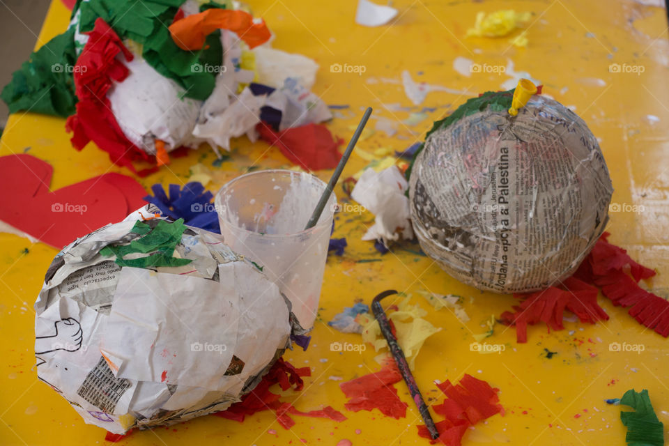 making a piñata with recycled paper