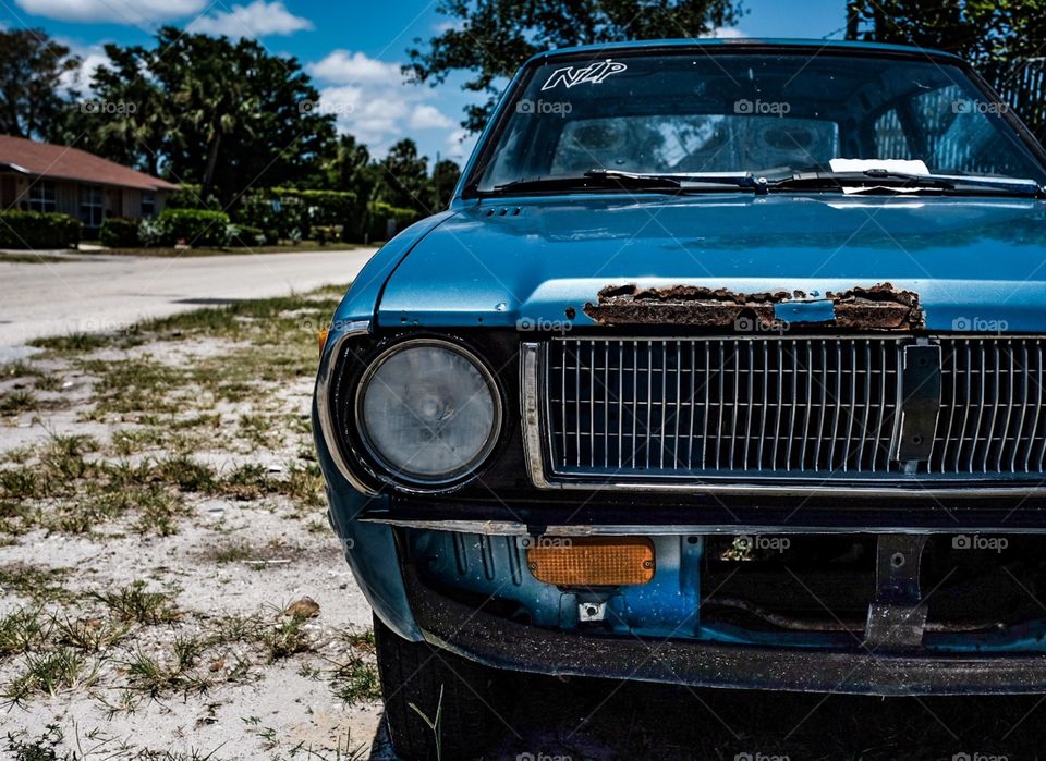 Old Blue Rusty Car.
