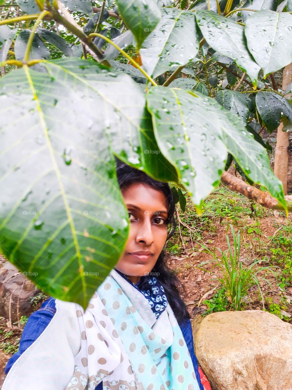 Hiding under the leaves in the rain for a selfie