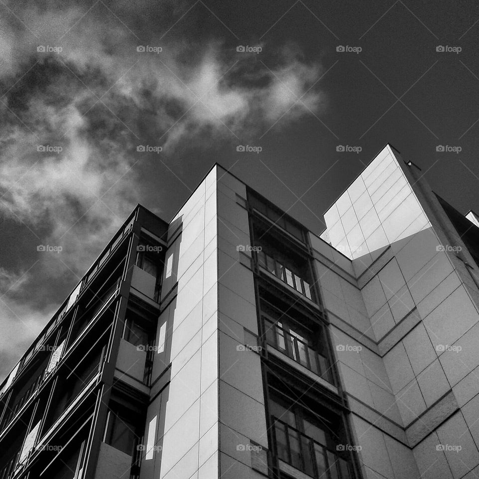 Looking up at tall building