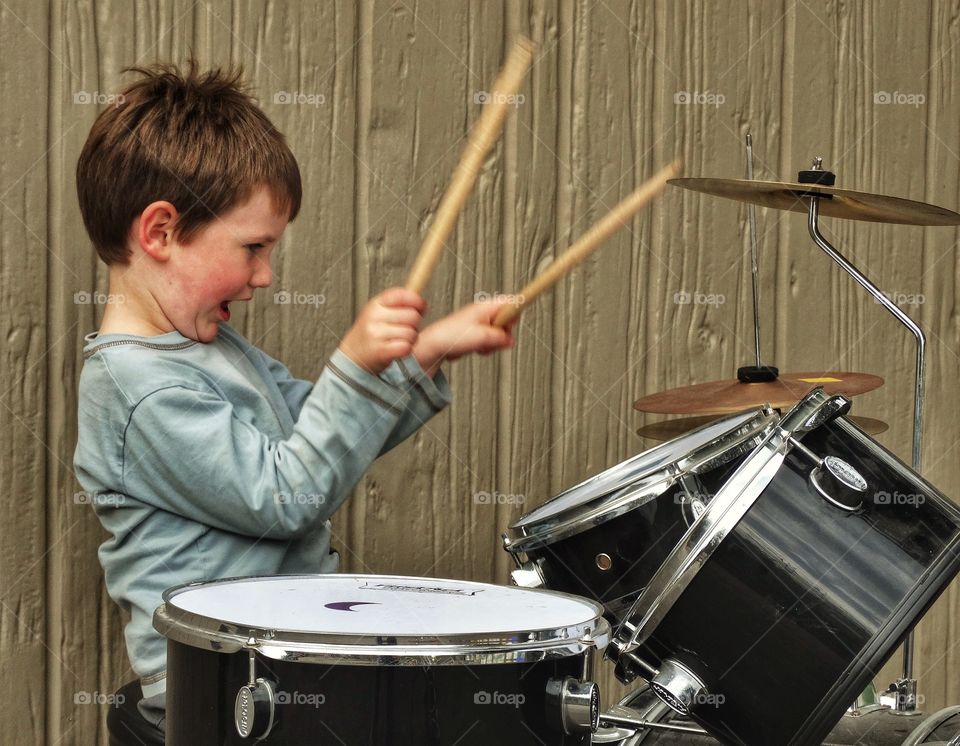 Happy Boy Playing Drums