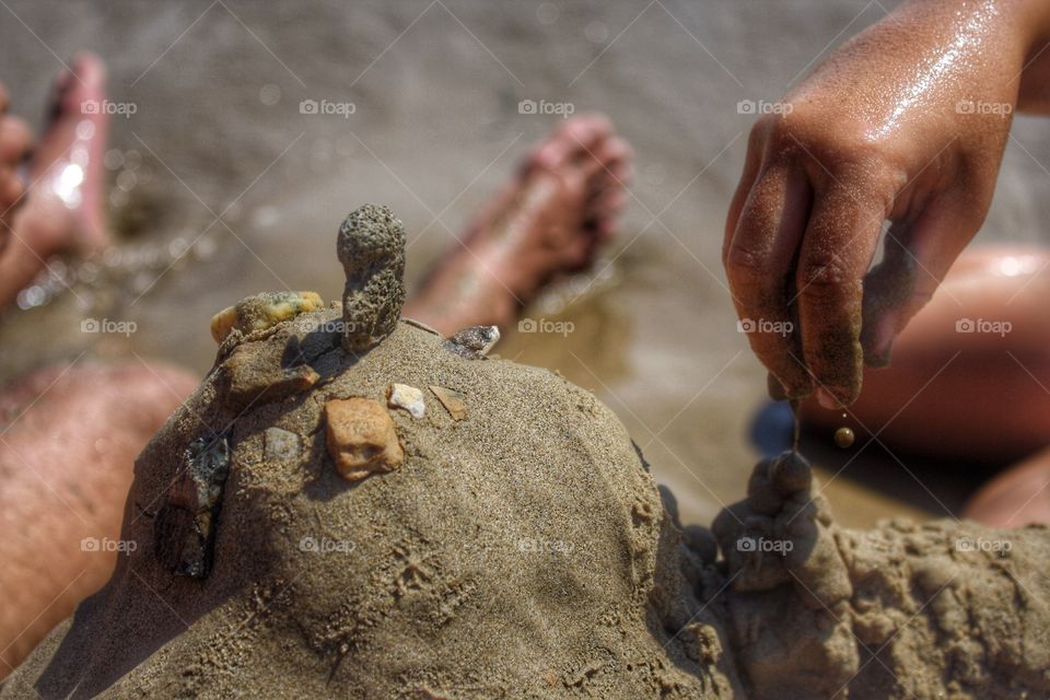 At the beach. Playing in the sand