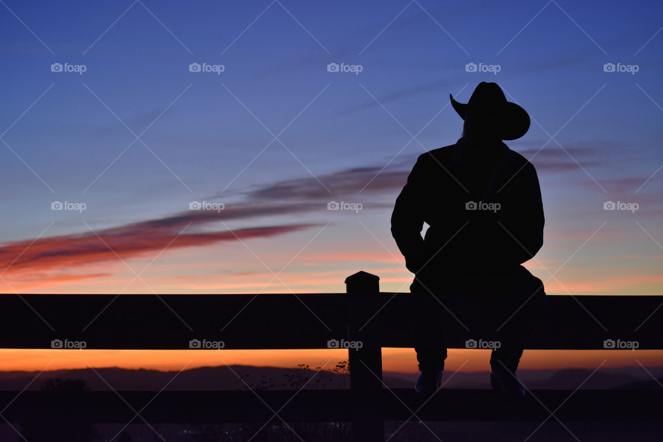 cowboy on fence