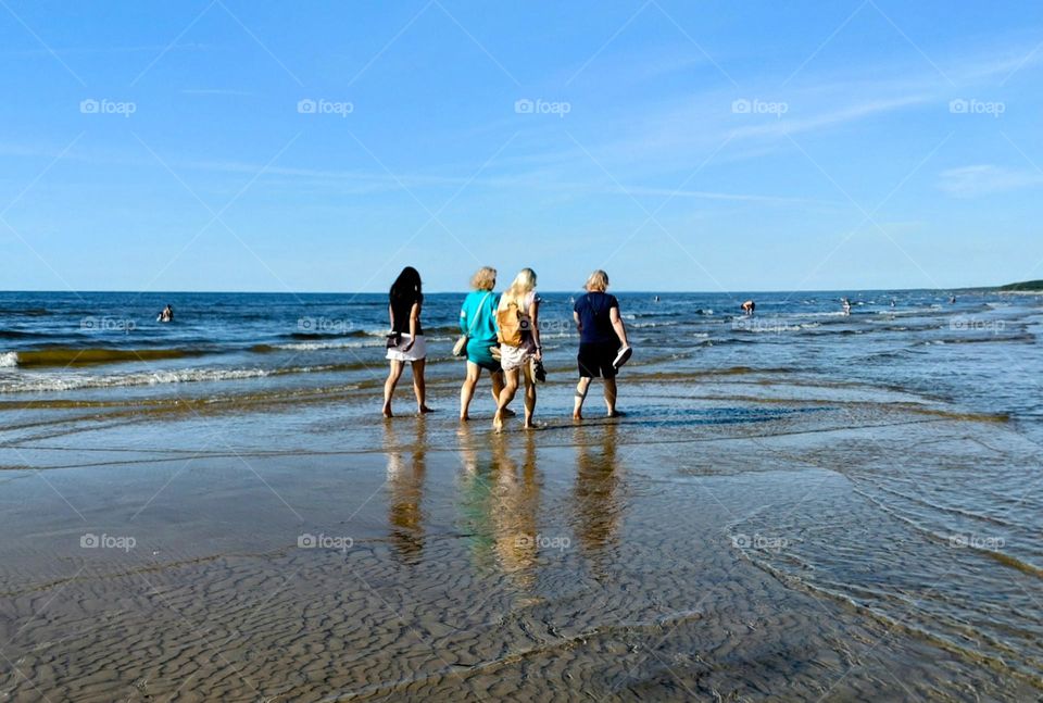 Summer time. The beach. Walking