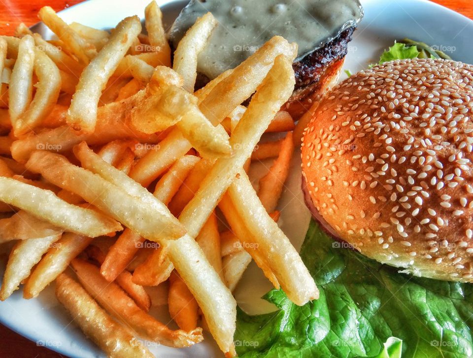American Cheeseburger And Fries. All American Junk Food
