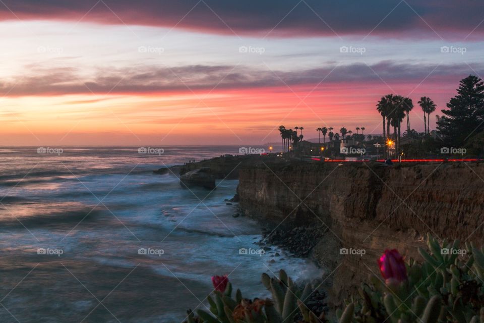 A sunset sinks below the horizon at the aptly named Sunset Cliffs of San Diego