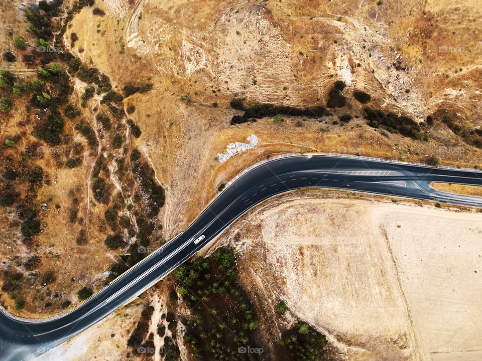 Tiny car on a road 