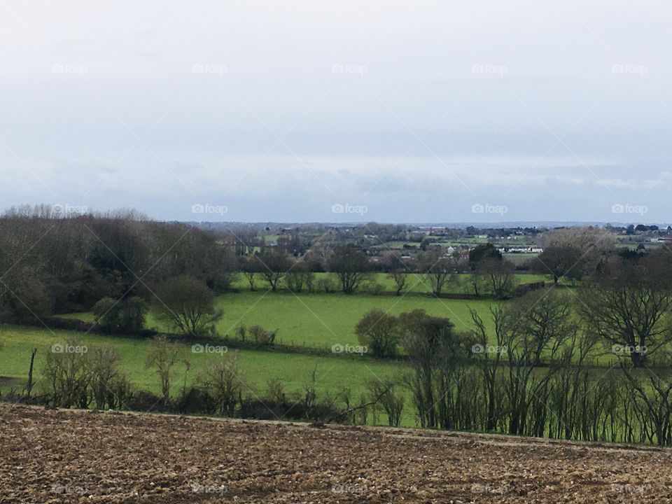 Over looking the village in which I live. A lovely English village in Kent with green fields inviting you to explore.