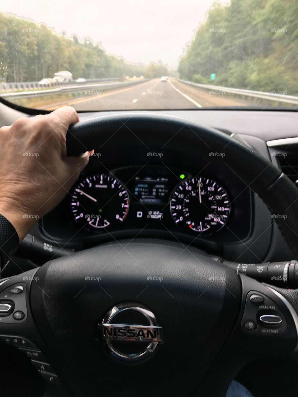 Dashboard as I'm driving down highway! Road seen ahead of me! Two lane highway.