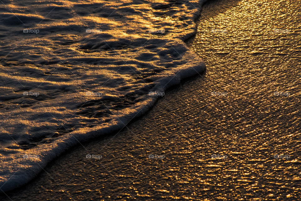 The shape of a wave during sunset time, feel the tranquility and relaxation
