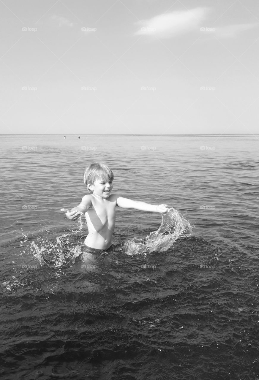 little boy in the sea