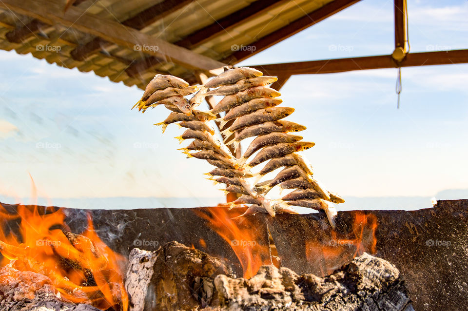 The espeto de sardinas is a dish typical of Malaga cuisine, which consists in spitting, that is to say, stringing fish, traditionally sardines, in thin and long canes, to roast it with firewood in the sand of the beach.