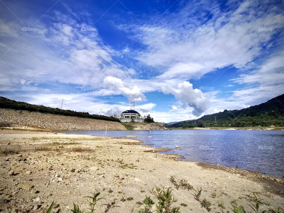 A natural reservoir with a cloudy a nice sky
