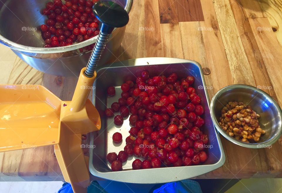 Fresh cherries being pitted