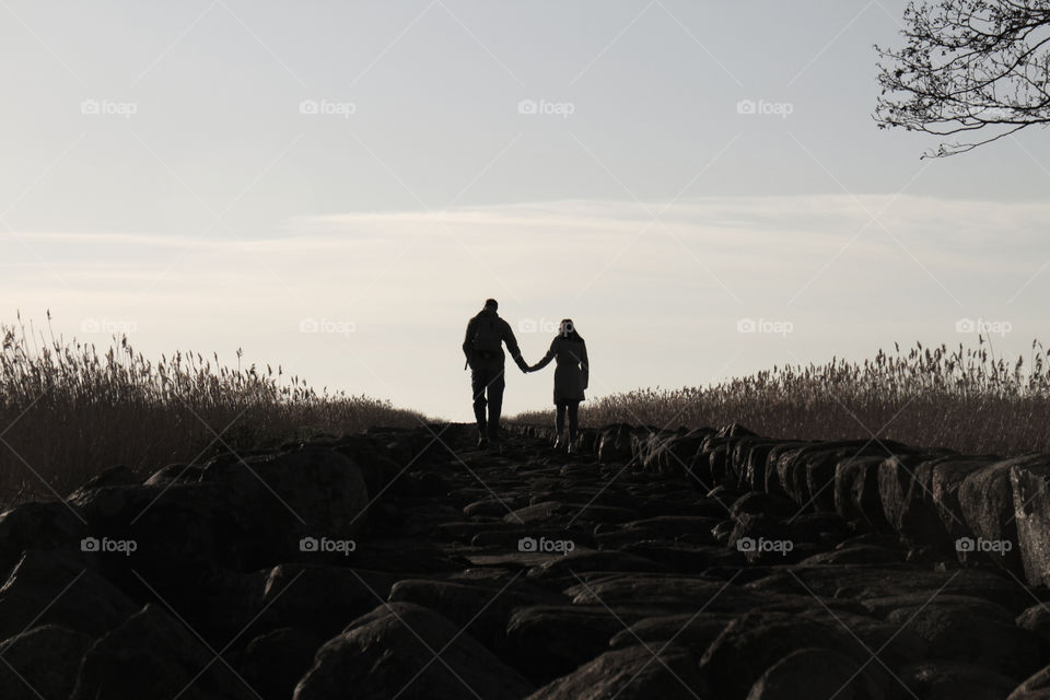 guy and girl go holding hands
