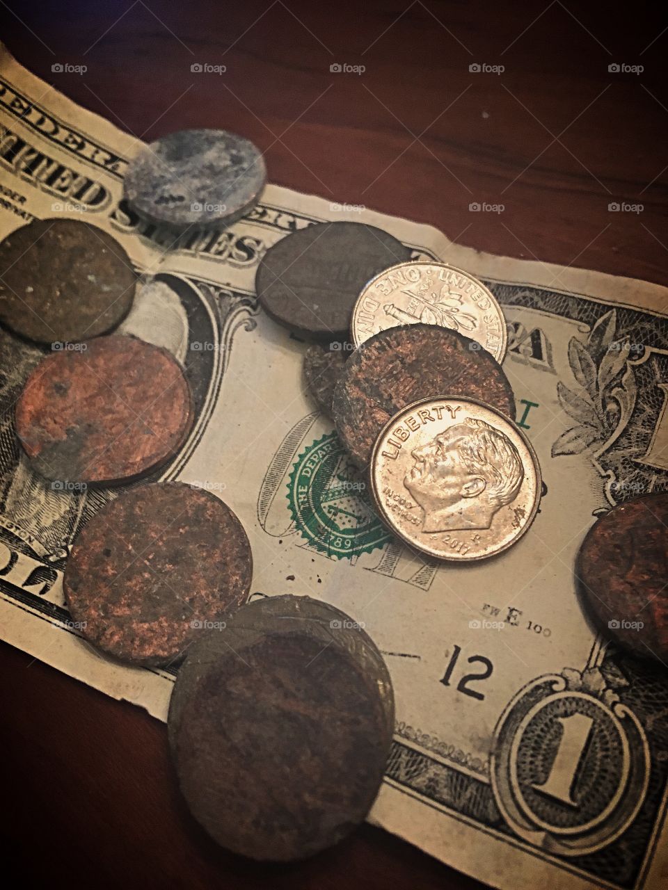 Lost and found - coins and a dollar bill found on morning walks over the span of a month. 