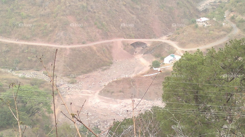 Dry river , mountains , bridge ,road
