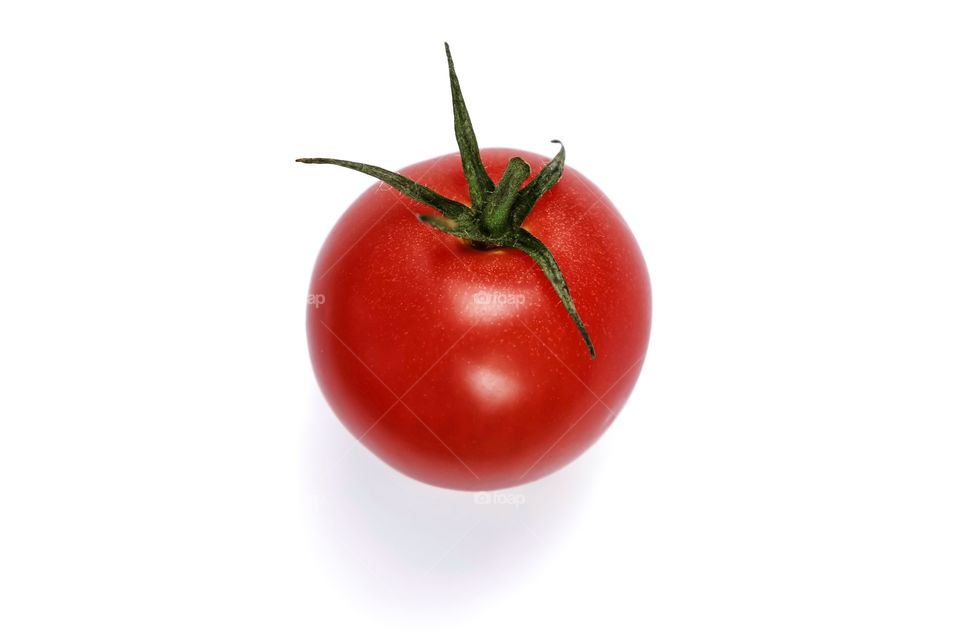 Red tomato on white background 