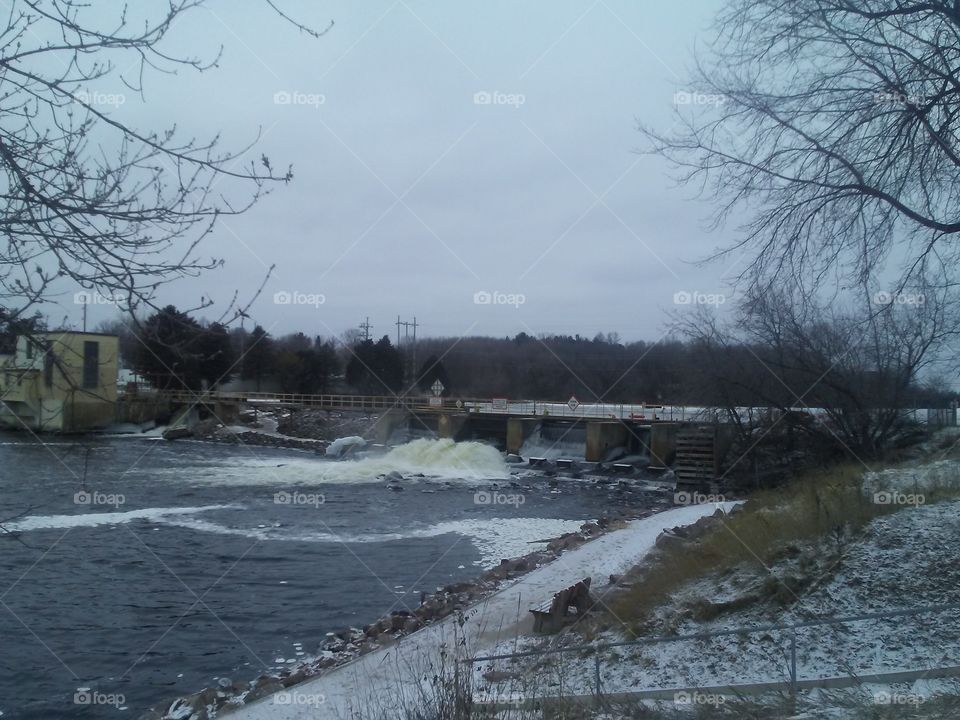 The Wolf River rushing through the dam by Sturgeon Park in Shawano, Wisconsin.