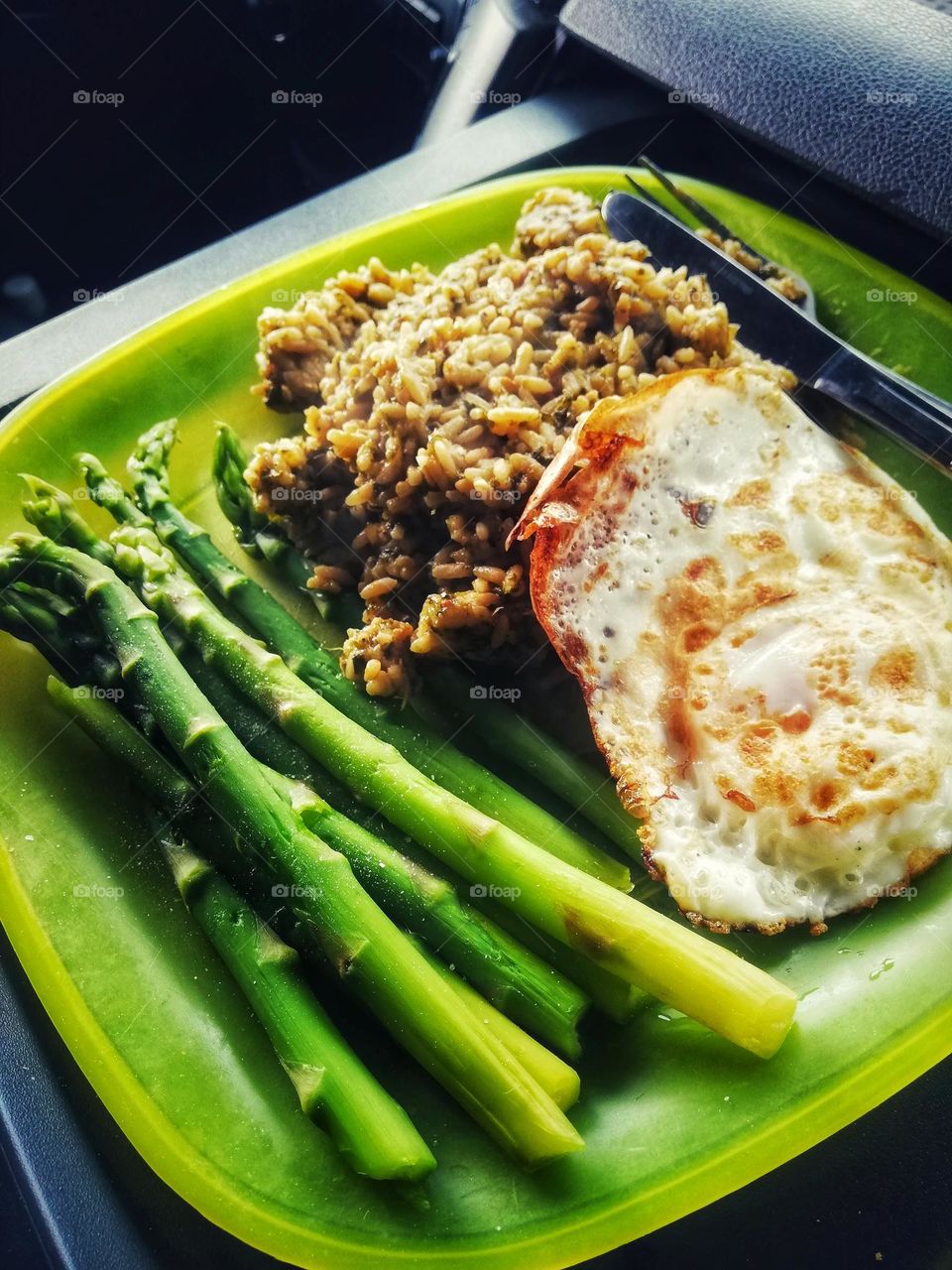 Healthy lunch in the truck. Asparagus with fried egg.