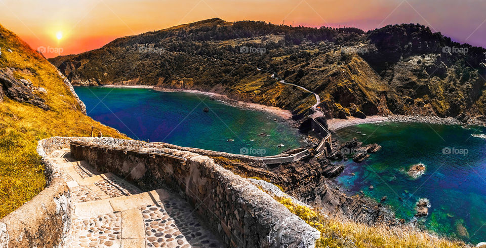 Panoramic view of San Juan de Gaztelugatxe stairs in Basque country, Spain. Idyllic landscape of long stairs over the ocean.