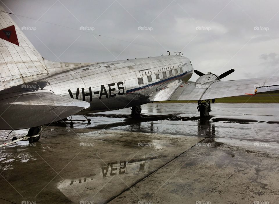 Old aeroplane - DC3 on a wet tarmac