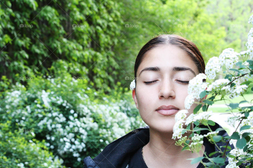 Teen girl relaxing in a garden