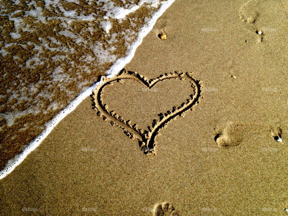 Heart drawn on sand