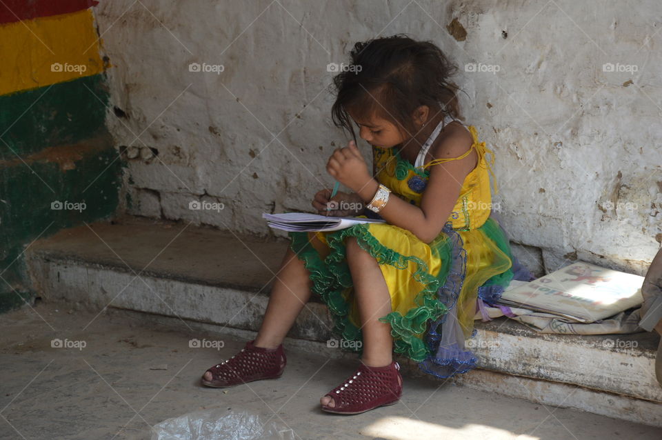 Girl doing homework, Varanasi India