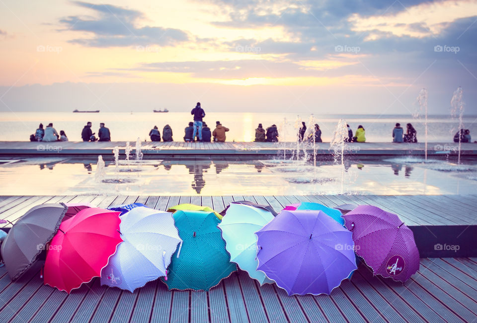 People At The Dock Enjoying The Sunset
