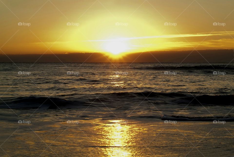 An October sunrise on Virginia beach is an awe inspiring celestial moment.