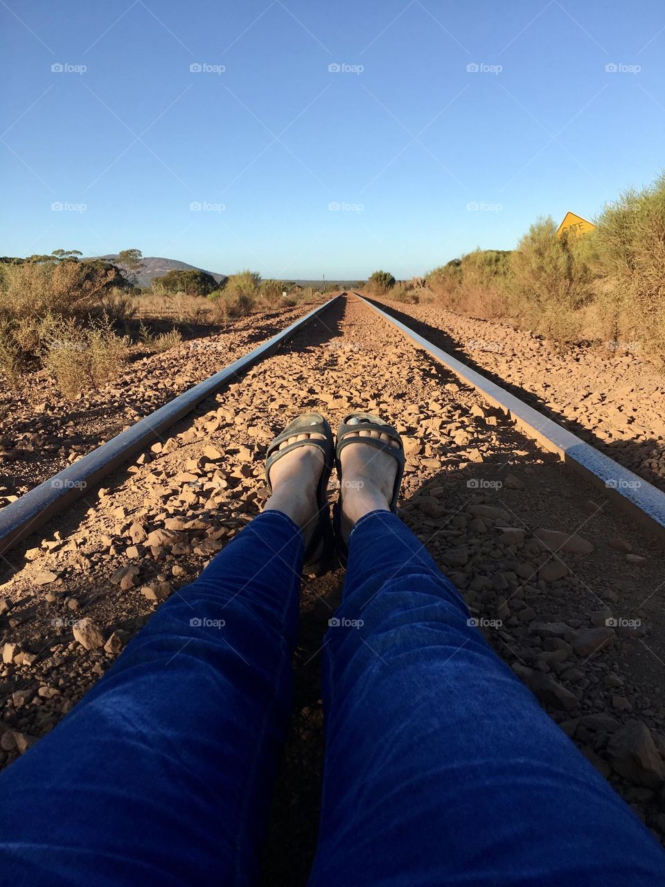 Ground perspective rural South Australia railway railroad tracks diminishing perspective Australian outback desert